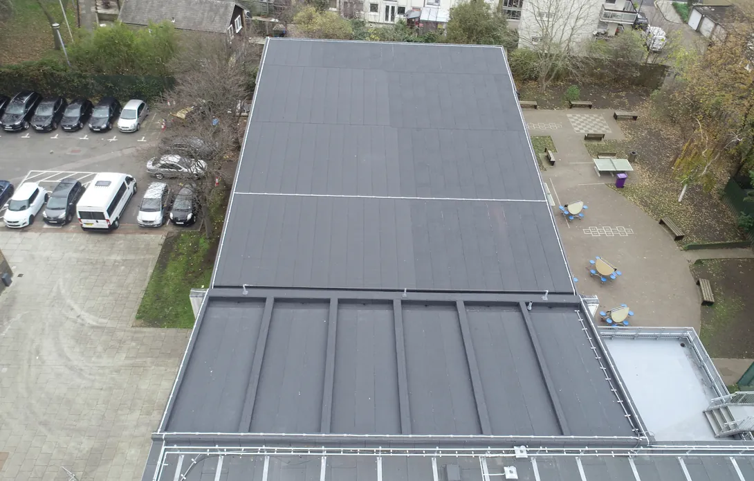 Completed assembly hall roof above the school playground and car park