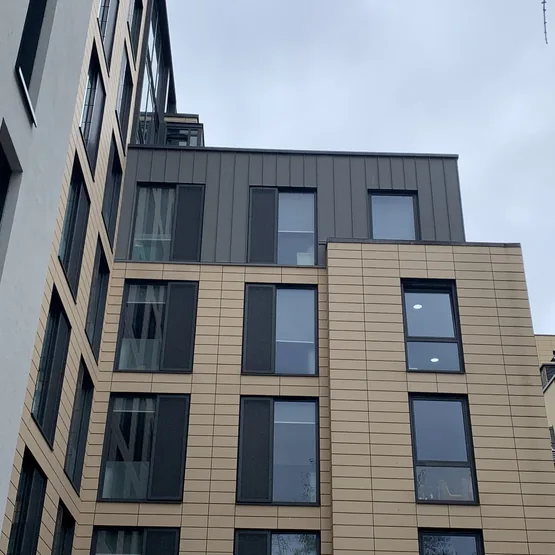 Glassyard student accommodation in Stockwell with new render and grey zinc cladding