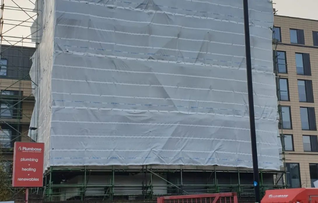 Eight-storey scaffold wrapped in protective sheeting during the façade works