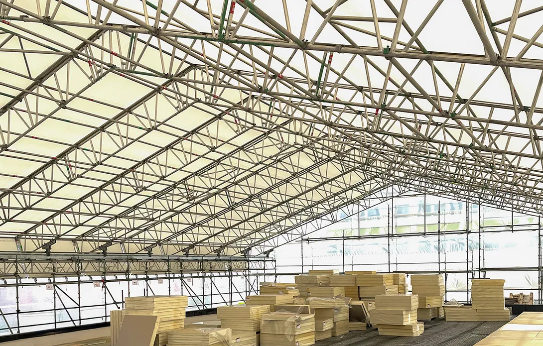 Temporary roof structure over a live food production facility in Leith, Edinburgh, during RAAC removal