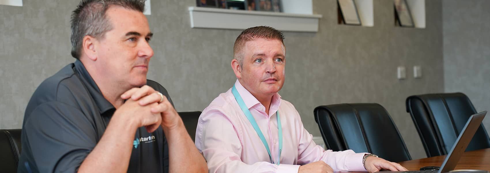 designers in a meeting looking at drawings