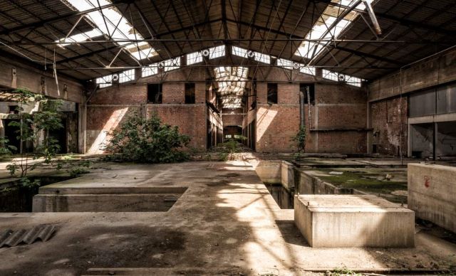 Derelict former industrial building interior awaiting remediation