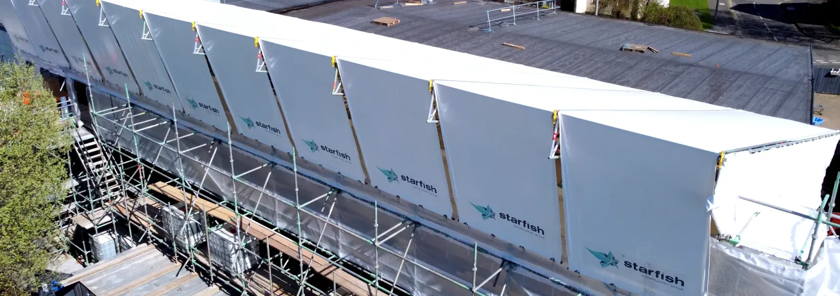 Starfish Construction temporary roof enclosure over a RAAC roof at a food production facility