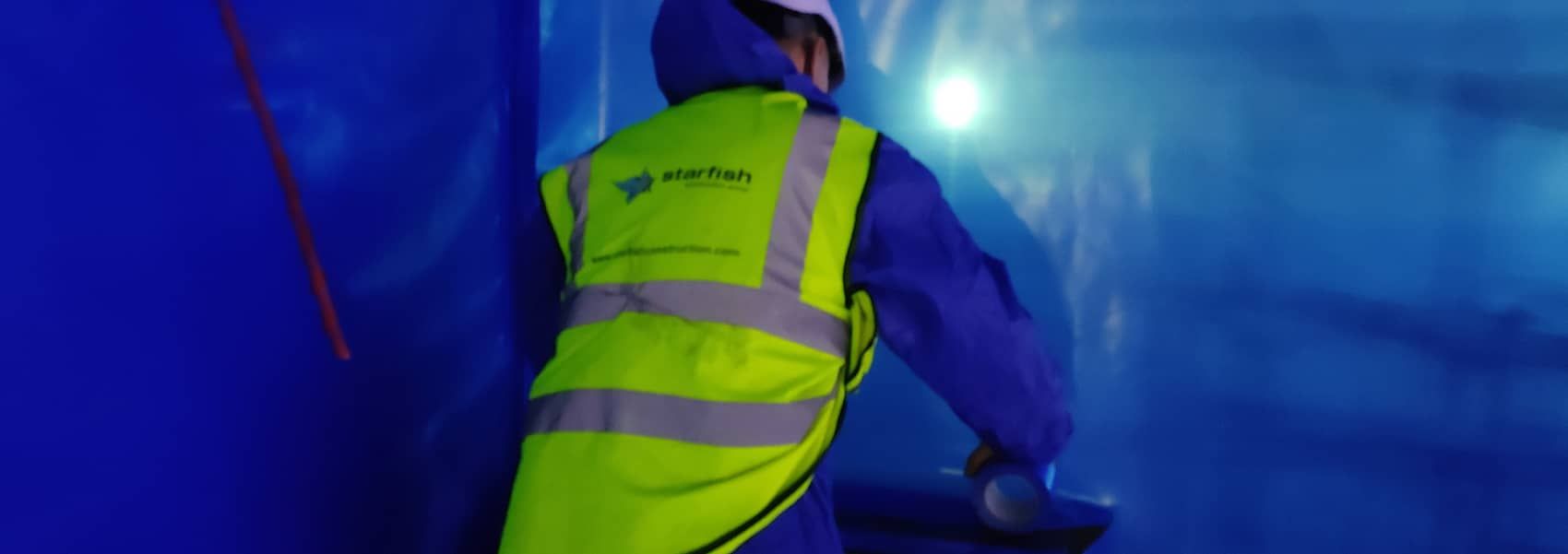 Starfish Construction engineer inspecting a façade of a multi-storey building