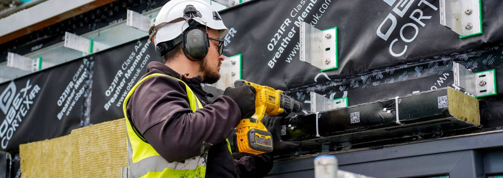 Starfish Construction engineer installing a façade on a multi-storey building