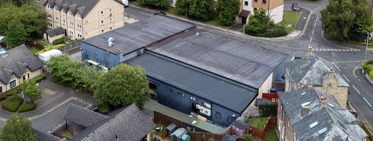 work people flooring an indoor space
