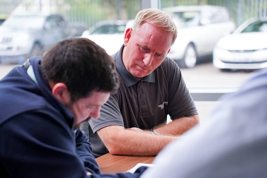 consultants reviewing a document