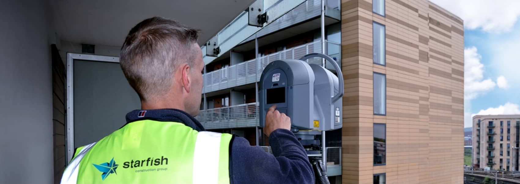 Starfish Construction engineer inspecting a façade of a multi-storey building