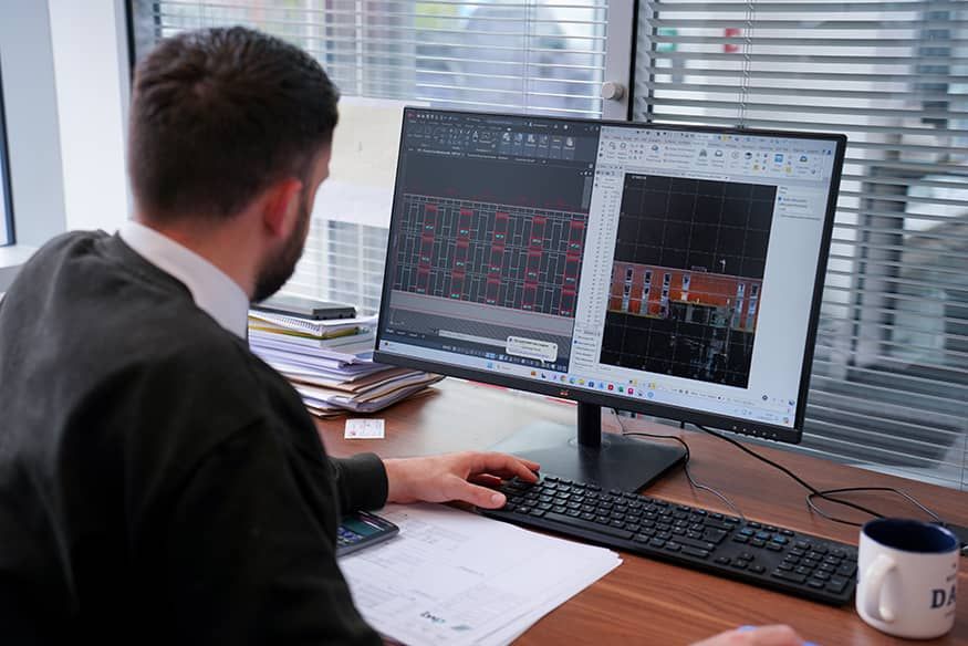technical survey man sitting at computer simulation