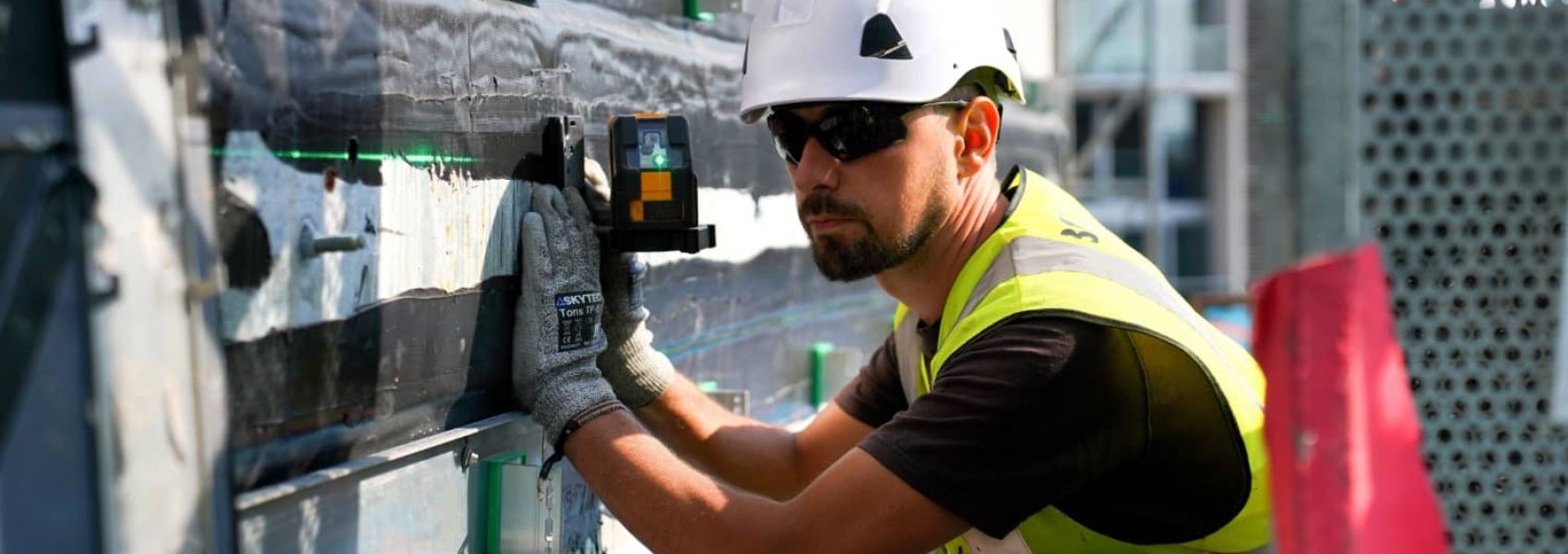Starfish Construction engineer inspecting a façade of a multi-storey building